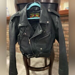 Heavy leather women’s vintage motorcycle jacket with lots of pockets